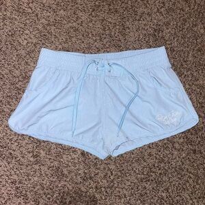 Baby blue Ron Jon surf shop short board shorts with pockets